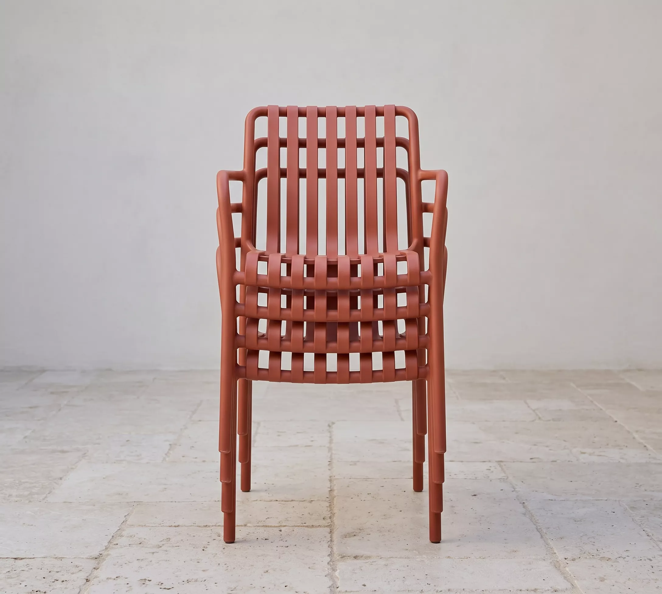 Twenty-five stacked Paris Chair chairs